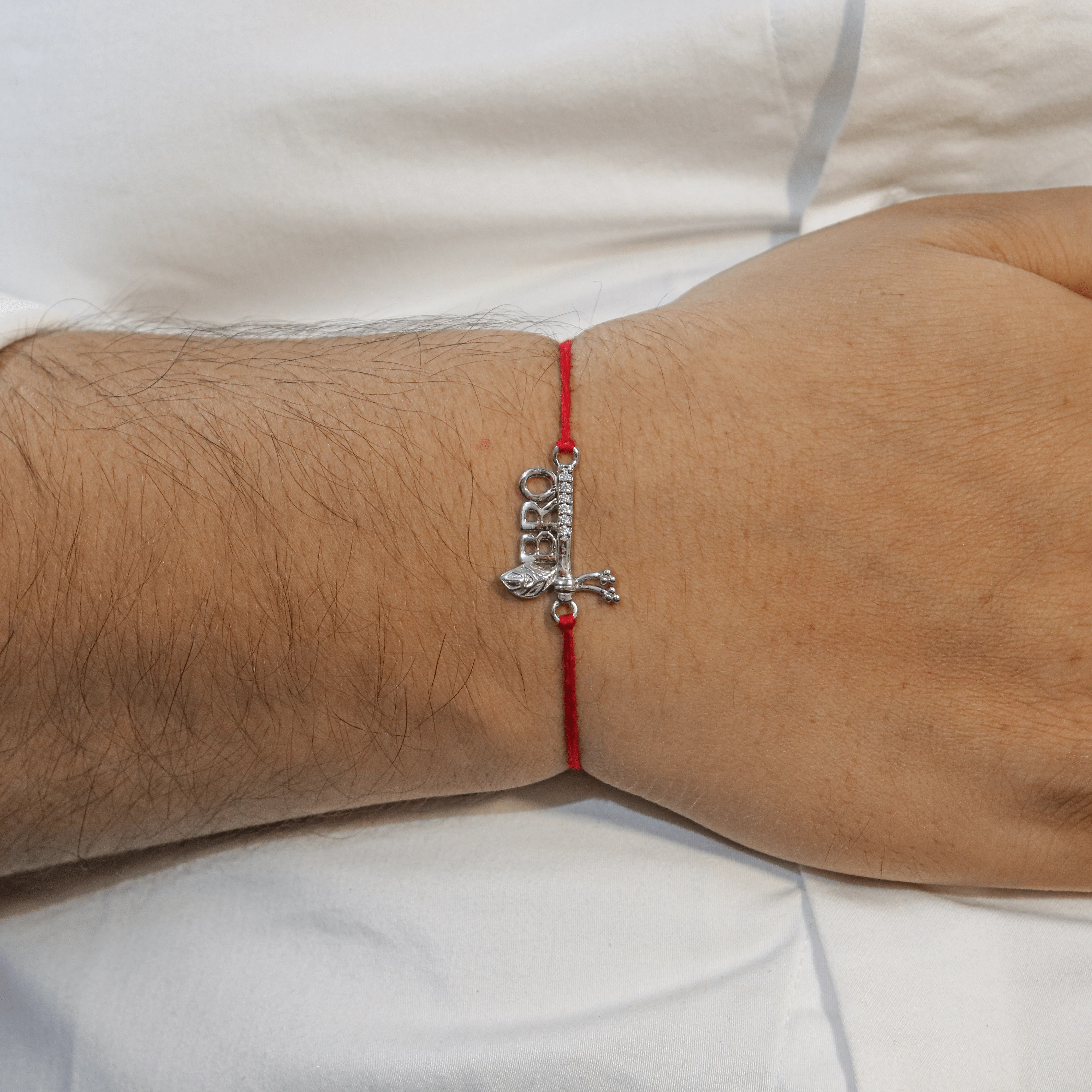 Zarkan Precious Silver Krishna Bansuri Rakhi For BRO With Roli Chawal - Image 3